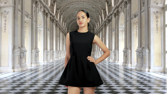 a woman wearing a sleeveless black blazer dress at a luxurious venue with a checkered floor tiles